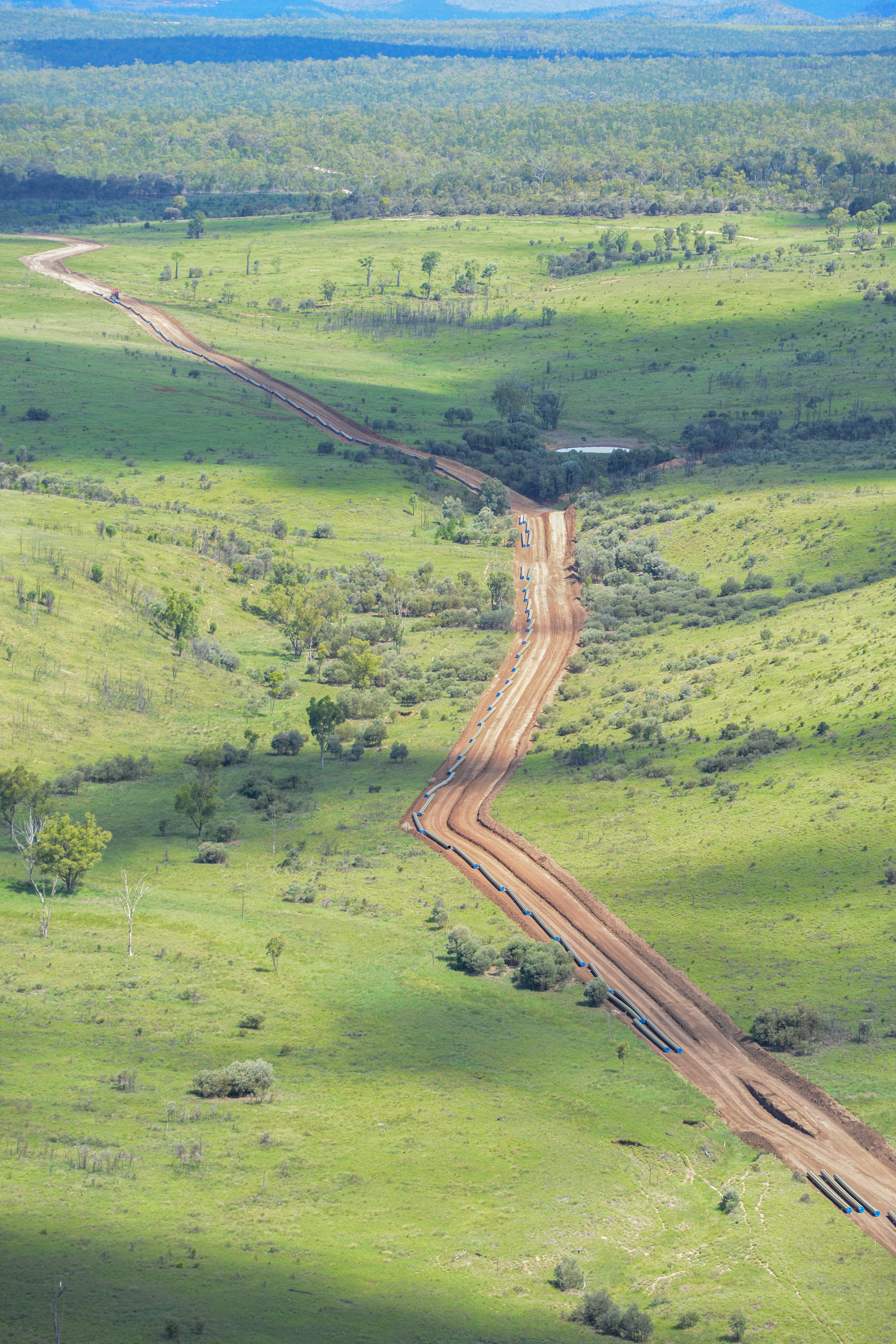 Dirt path over green terrain